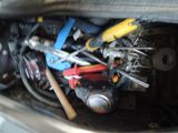a close up of a bunch of tools inside of a car