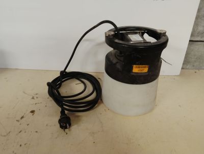 an image of a black and white sprayer sitting on top of a table