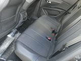 the back seats of a car are covered in black cloth