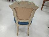 a chair that is sitting in the middle of a room