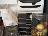 a desk with a lot of office supplies on it