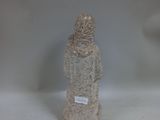 a small statue of a person standing on a white surface