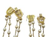 two pairs of gold and pearl earrings with a chain