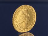 l'image d'une pièce d'or sur laquelle figure une tête de femme