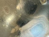 a close up of a metal object with holes in it