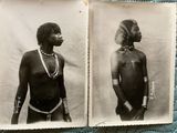 an old black and white photo of a man with tattoos on his chest