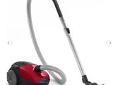 a red and black vacuum cleaner and a black and white vacuum