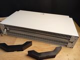 a laptop computer sitting on top of a wooden table