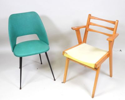 two chairs sitting next to each other on a white surface