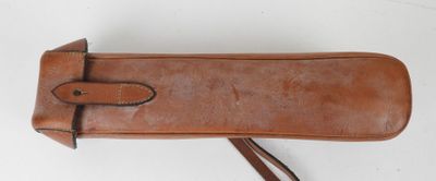 an image of a brown leather case with a long strap