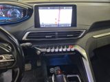 a car dashboard with a digital display and a steering wheel
