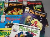 a lot of comic books sitting on a table