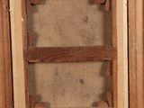 an old picture of a window with a wooden frame on the outside of it