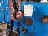 a picture of a machine that is working on a piece of machinery
