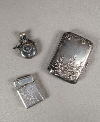 a silver flaskt and a silver lighter on a table