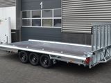 an image of a flatbed trailer parked in front of a building