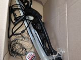 a black and white hair dryer in a cardboard box