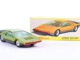a toy car that is sitting in front of a box