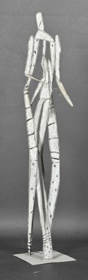 a sculpture of a man holding a knife on a pedestal