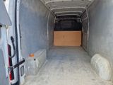 a white van with a wooden box in the back of it