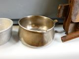two bowls and a bag sitting on a counter