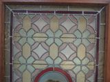 a picture of a stained glass window with a picture in it