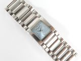 an image of a silver wrist watch with a blue face on a white surface