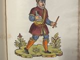 an old book with a picture of a man holding a sword