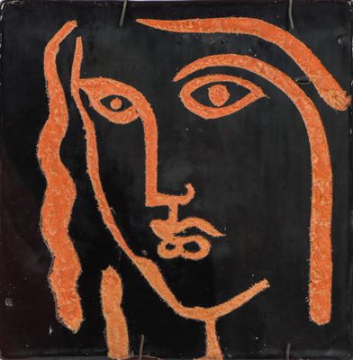 an orange and black painting of a woman ' s face on a black background