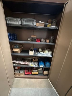 a closet with a lot of items on the shelves