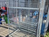 a large metal cage filled with lots of bottles of water