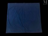 a close up of a blue towel on a black background
