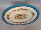 a blue and white plate with a floral design on it