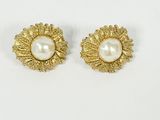 a pair of pearl and gold earrings