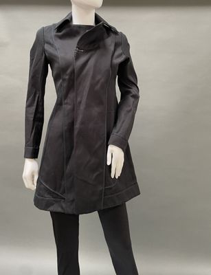 an image of a mannequin wearing a black coat and leggings