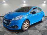 a blue car is parked in a room with a checkered floor