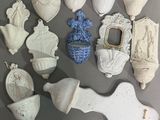 many different pieces of pottery on the table