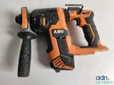 a drill and a hammer on a white surface