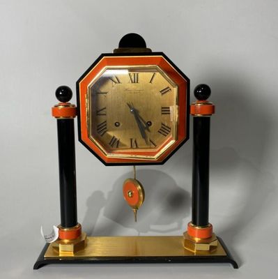 a clock that is sitting on top of a stand