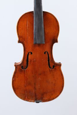 an old violin with a black bow on a white background