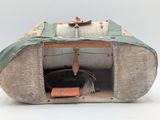 a small piece of luggage sitting inside of a box
