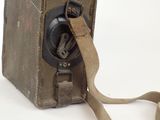 an old fashioned phone with a strap on it