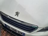 a picture of a white car parked on the side of the road