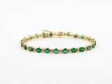 Bracelet tennis en or jaune 14 carats, serti d'émeraudes et de diamants