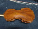 a violin that is sitting on a table