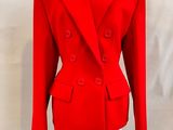 red jacket on a mannequin stand on a white background