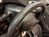 a close up of a steering wheel in a car