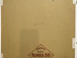 an old picture of a brown box with a number 90 on it