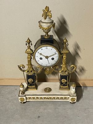 a clock that is sitting on top of a table