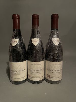 three bottles of wine sitting on top of a table next to each other
